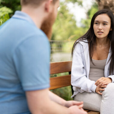 A man speaks to a domestic abuse support worker.