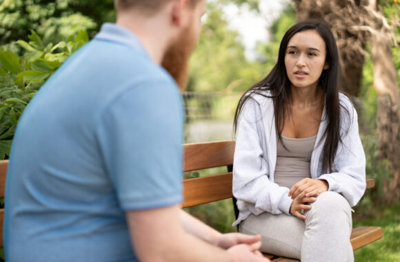 A man speaks to a domestic abuse support worker.