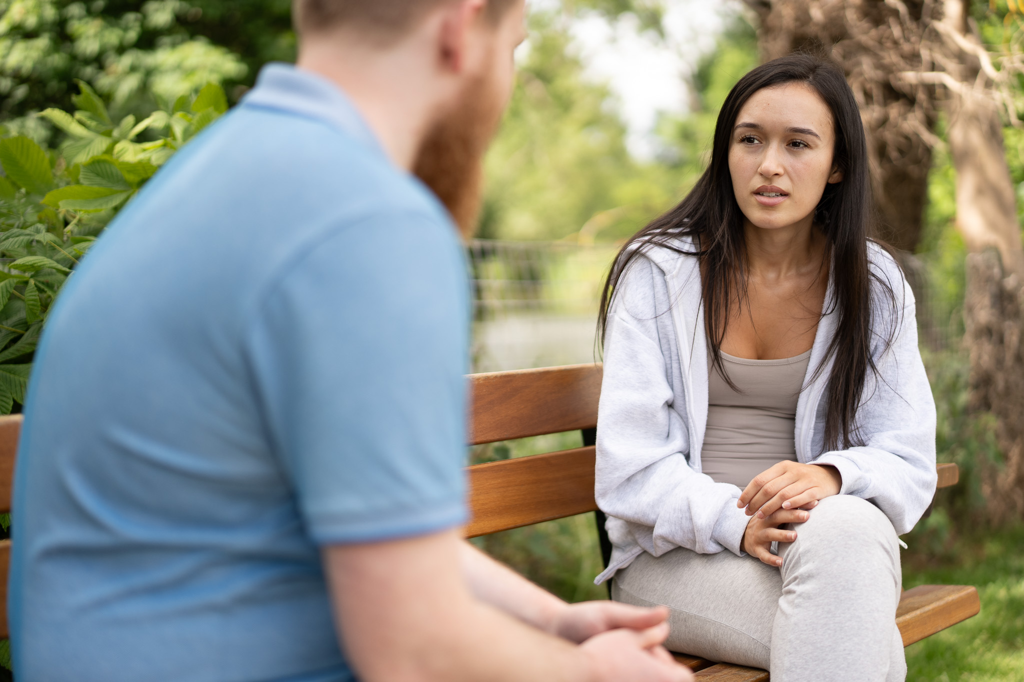 A man speaks to a domestic abuse support worker.