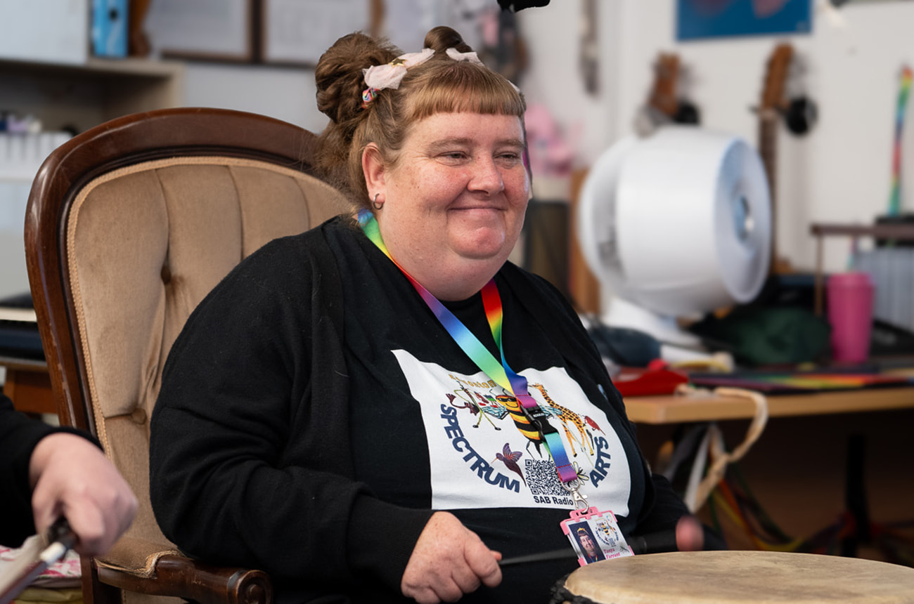 A service user playing musical instrument