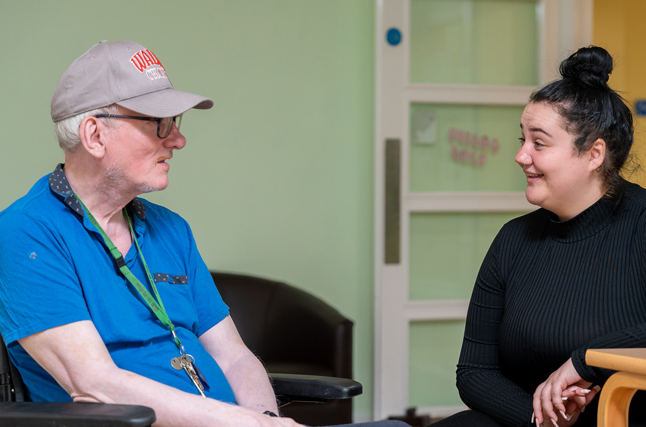 A service user talking with a member of staff
